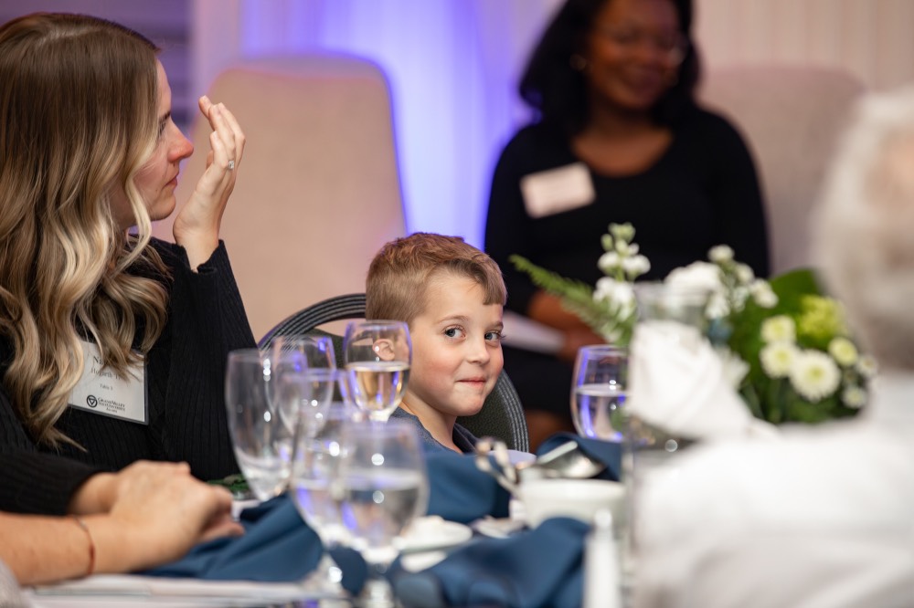 Alex Hogarth's son looking at camera